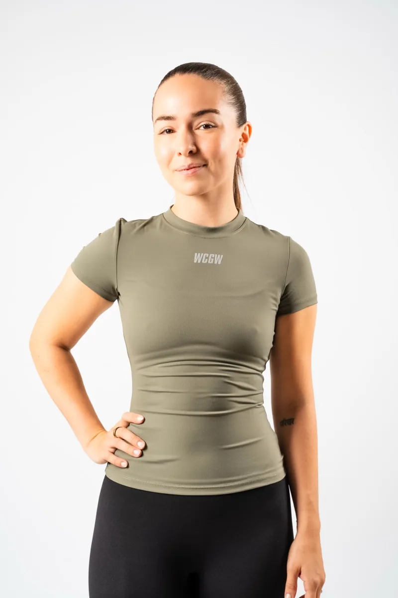 Woman in an olive green WCGW tee